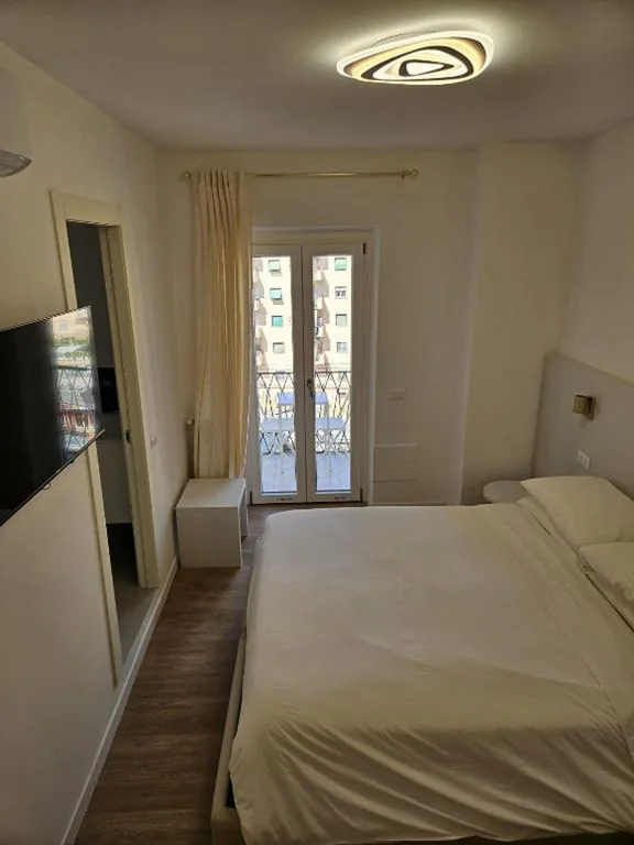 Queen Room with Balcony — Toto San Paolo Rooms
