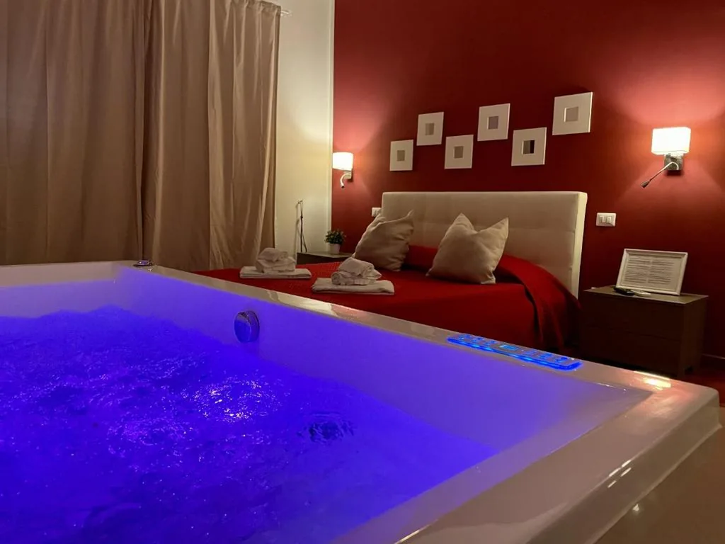 Queen Room with Hot Tub — Le Coq Suites