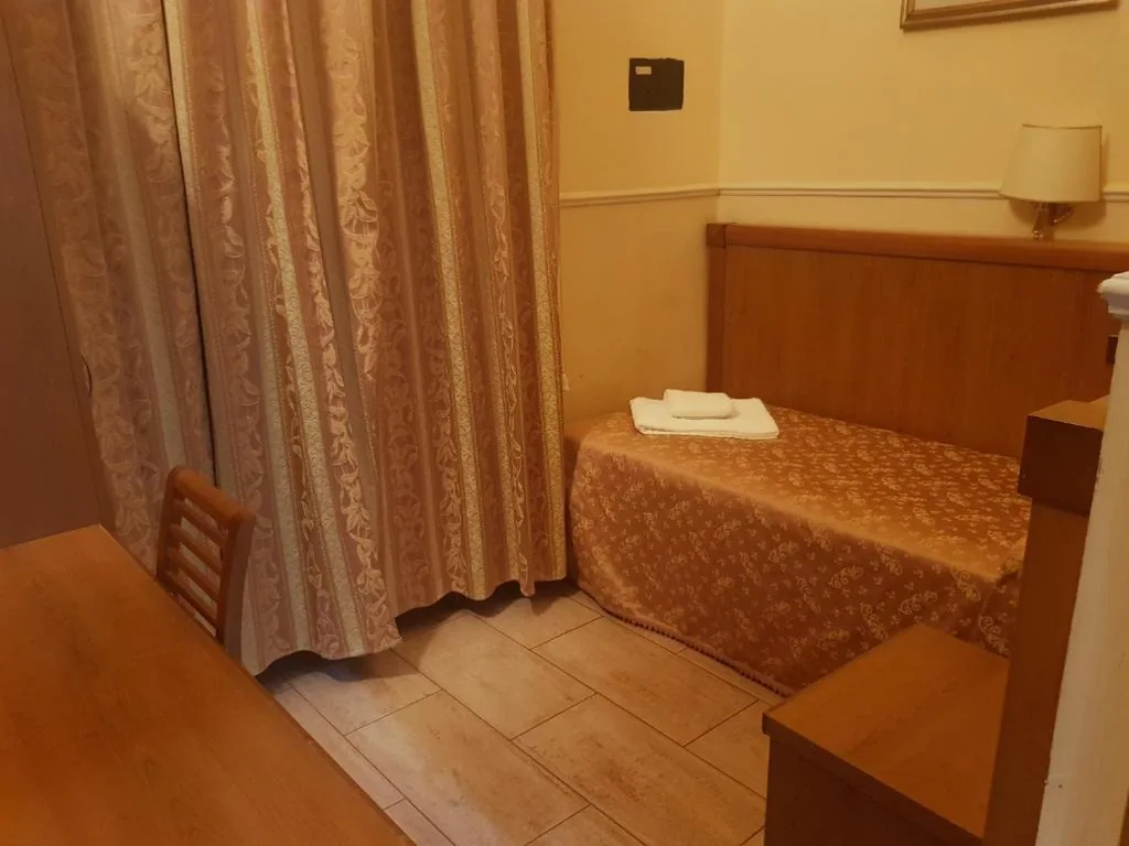 Single Room with a Single and a Half Bed — Hotel Aristotele
