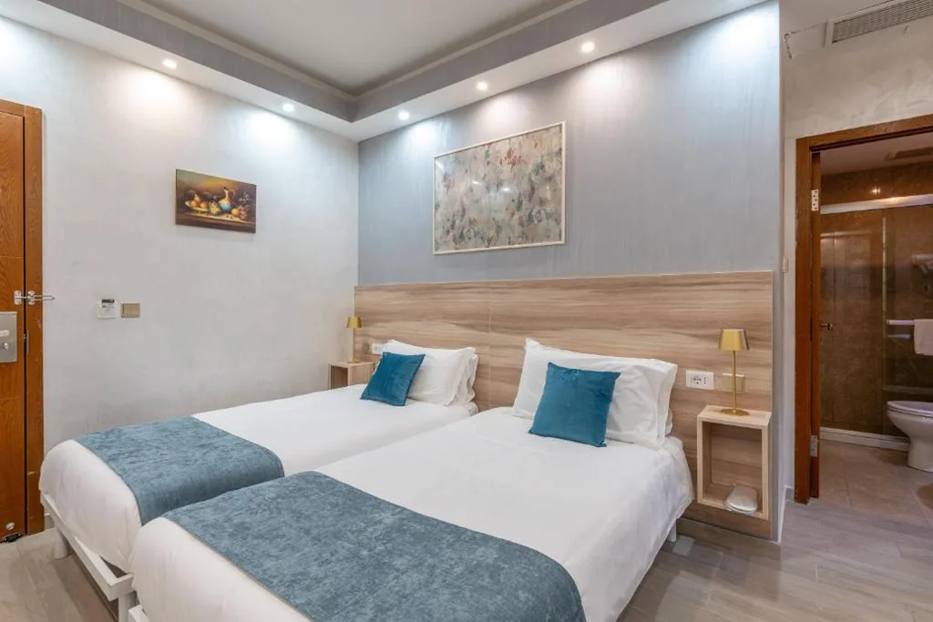 Standard Double Room with Single Beds — Leone D’Oro Guesthouse