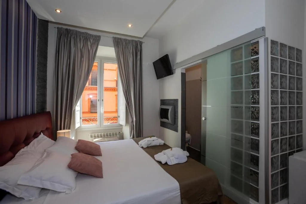 Camera Superior Doppia con Letti Singoli con Vista Città — Vatican Suites – The Luxury Leading Accommodation in Rome