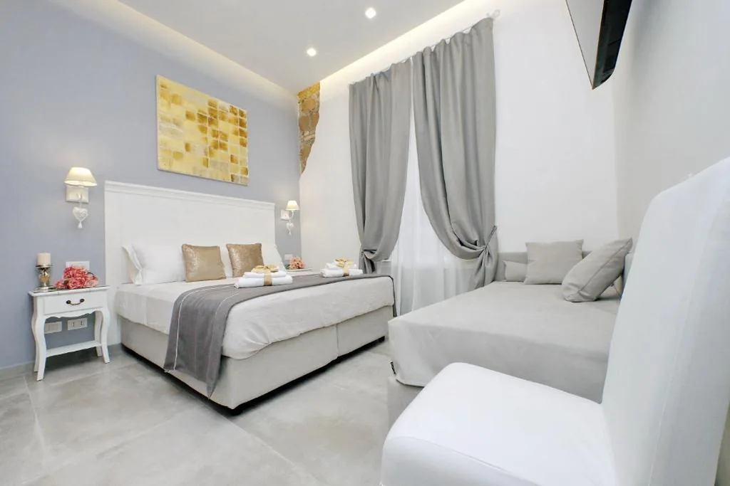 Comfort Triple Room — Roman Holiday Suites