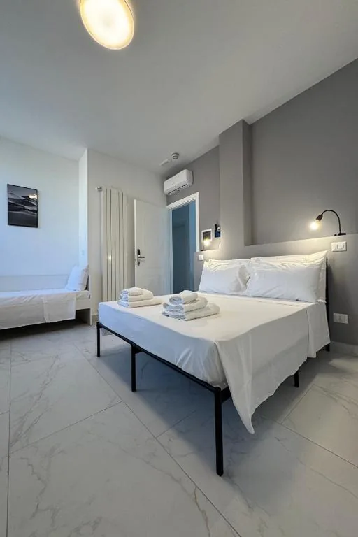 Camera Tripla con Bagno Privato — AMINA Guest House