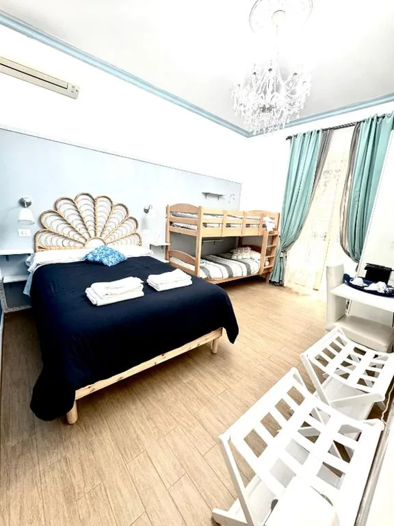 Triple Room with Balcony — Etere in Prati Rooms