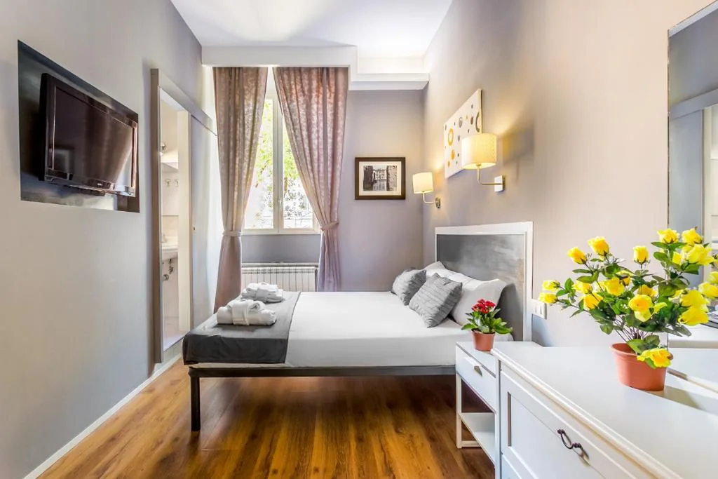 Triple Room with Garden View — AmoRoma Suite