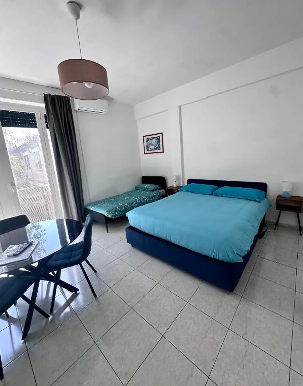 Triple Room with Garden View — Domus Olimpionici