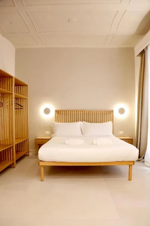 Triple Deluxe Room — Domus Maxima – Rome Suite & Rooms