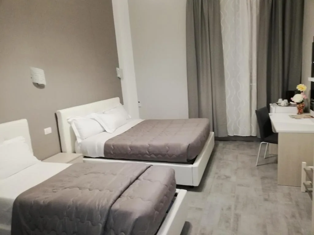 Deluxe Triple Room — Garden’s Elide