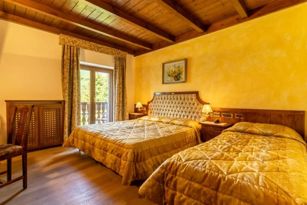 Deluxe Triple Room — Hotel Des Alpes
