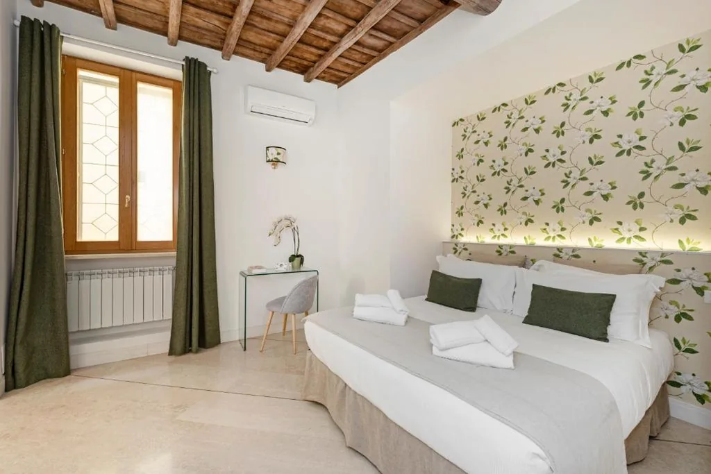 Camera Tripla Deluxe — i Fiori de’ Mario Suites