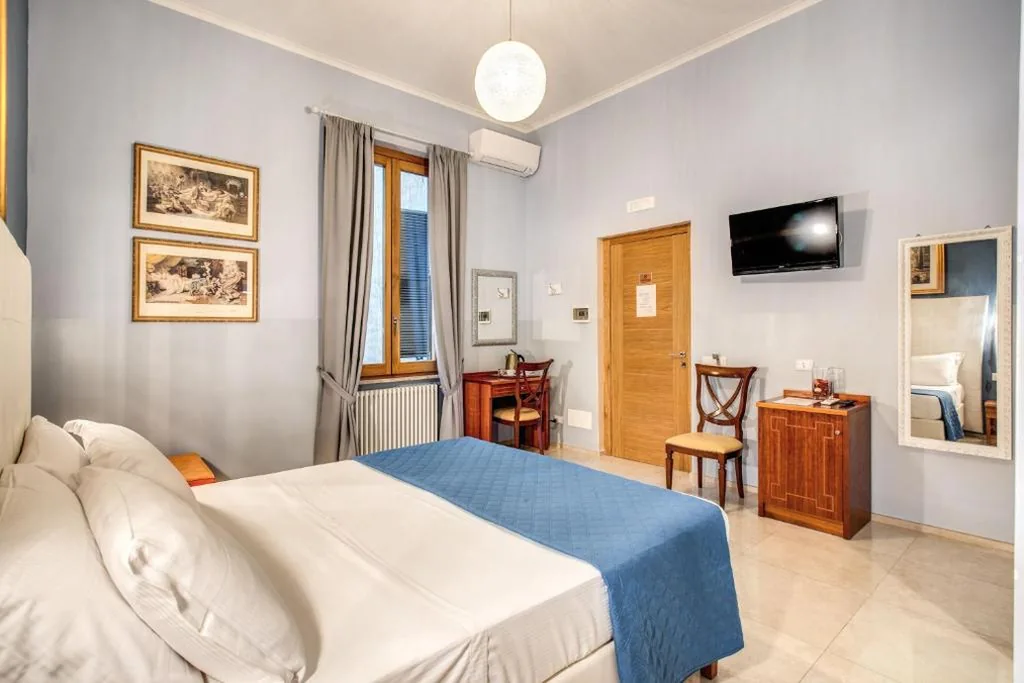 Camera Tripla Deluxe — La Residenza Suites