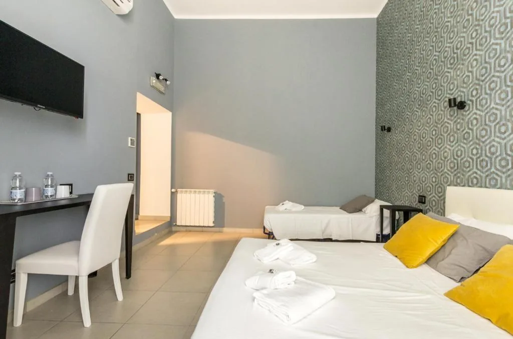 Deluxe Triple Room — Merulana 139 Suites