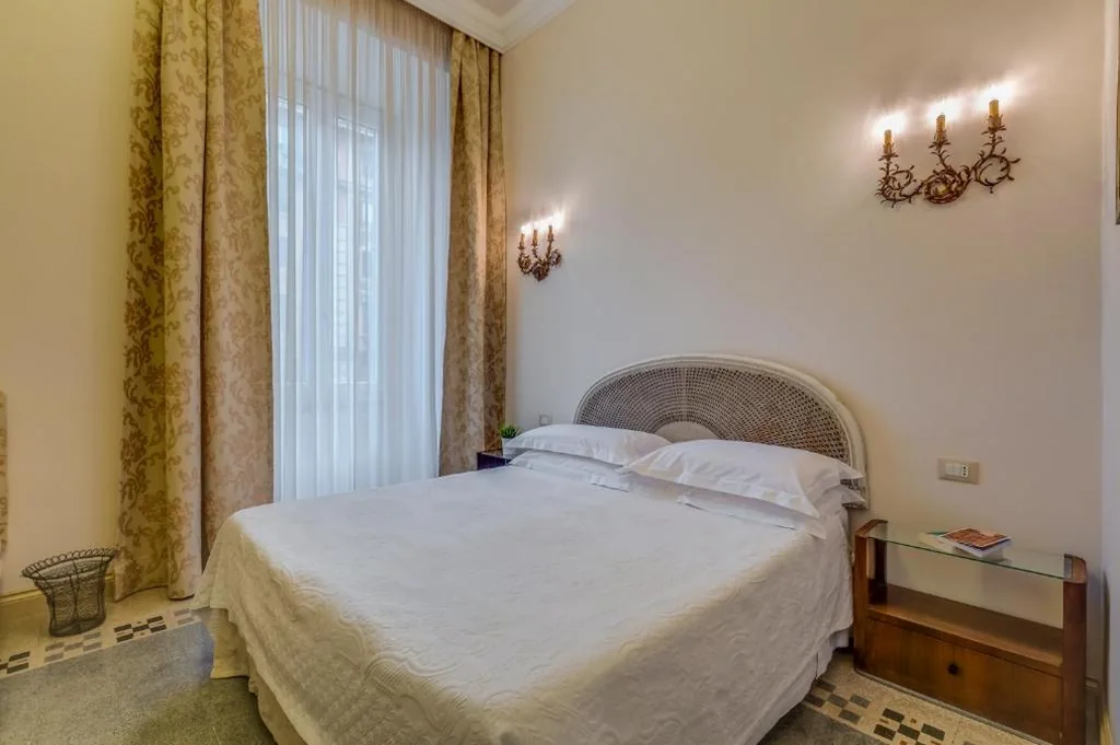 Camera Tripla Deluxe — Rome Charming Suites