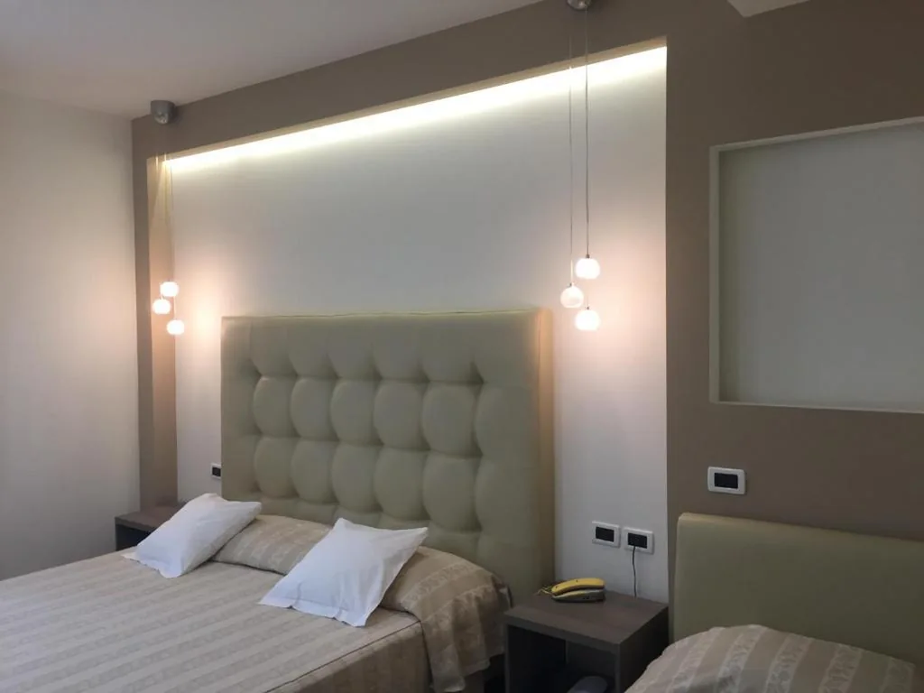 Deluxe Triple Room — Villa Accini