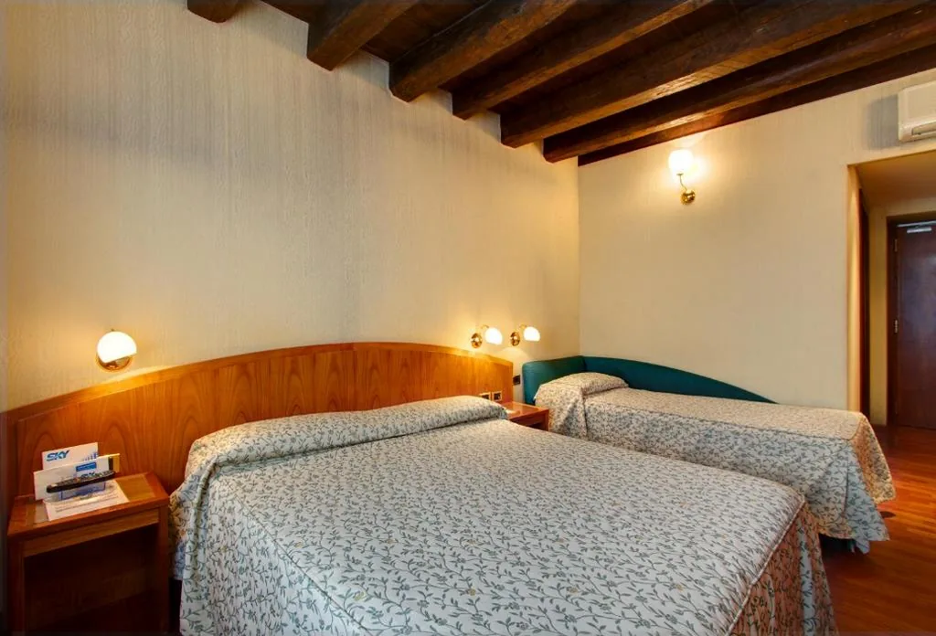 Triple Room — Hotel Corot