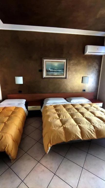 Triple Room — Hotel Emiliana