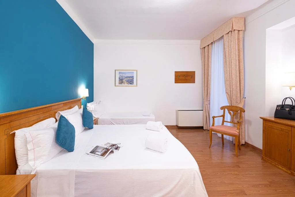 Standard Triple Room with Balcony — LVG Hotel Collection – Majestic