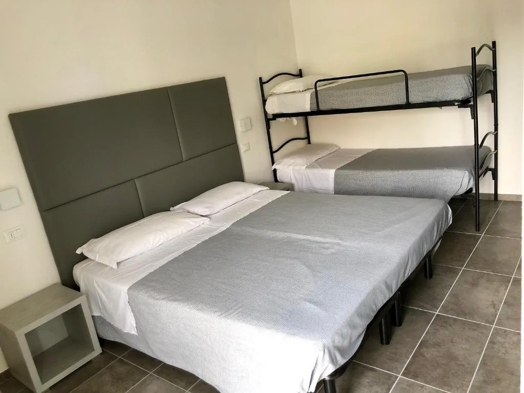 Quadruple Room with Balcony — Hotel Eugenio