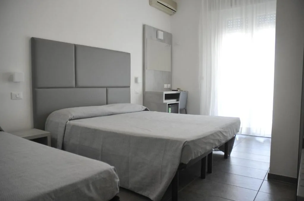 Triple Room with Balcony — Hotel Eugenio
