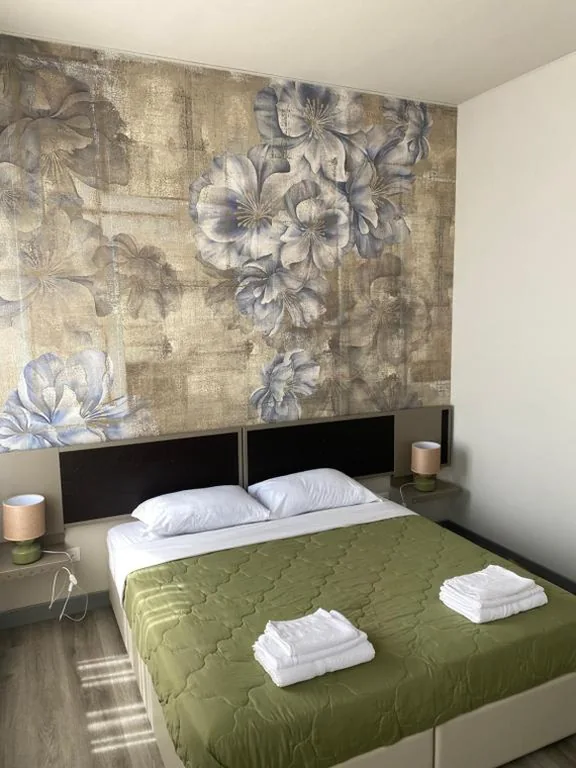 Deluxe Double Room with Twin Beds — Albergo Leon D’Oro