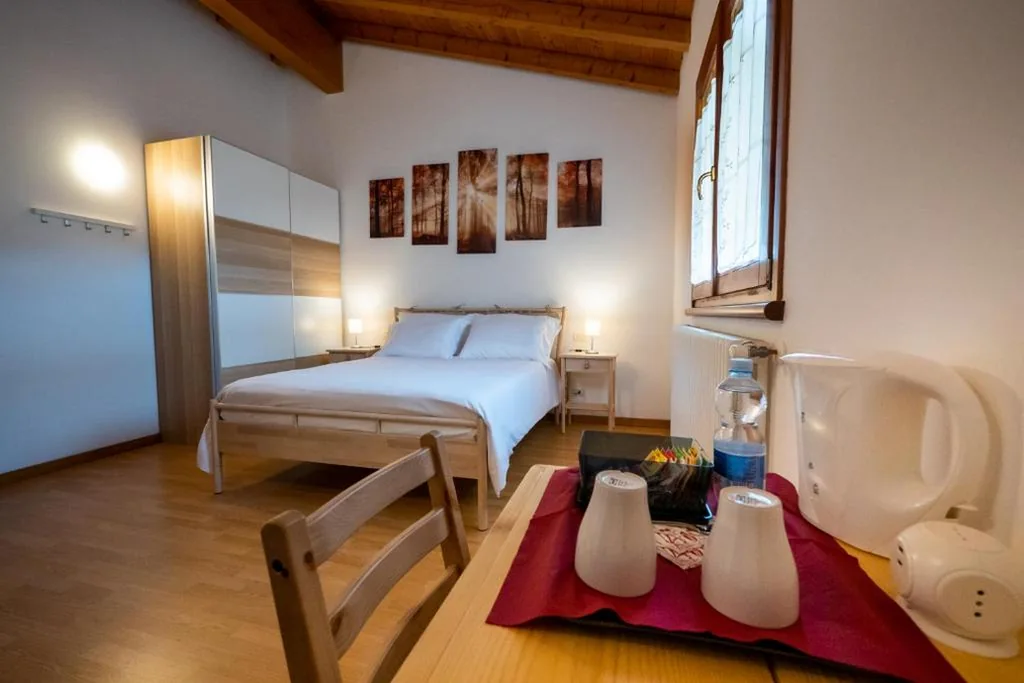 Camera Matrimoniale con Letto Supplementare — Affittacamere LA SCALA