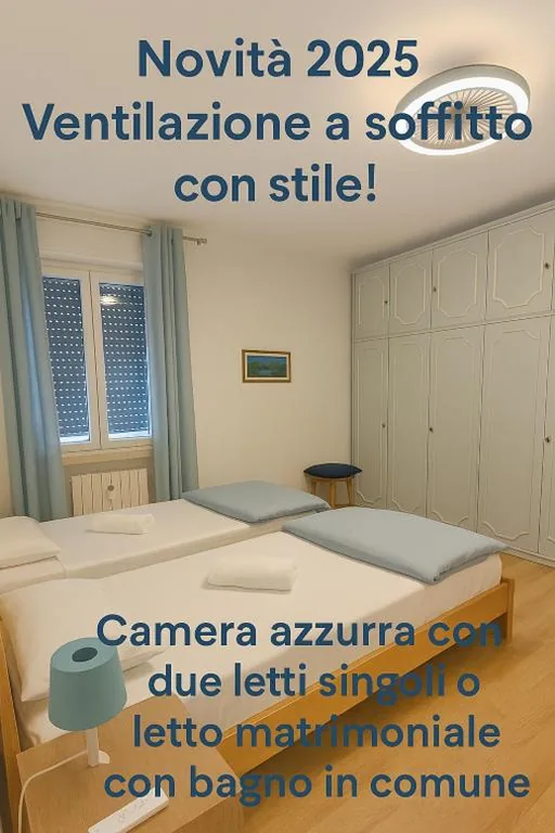 Camera Matrimoniale/Doppia con Letti Singoli con Vista Montagna e Bagno in Comune — Affittacamere Fiocco di Neve