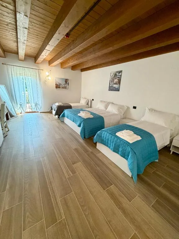 Camera Quadrupla Comfort — Hotel AL COLLIO