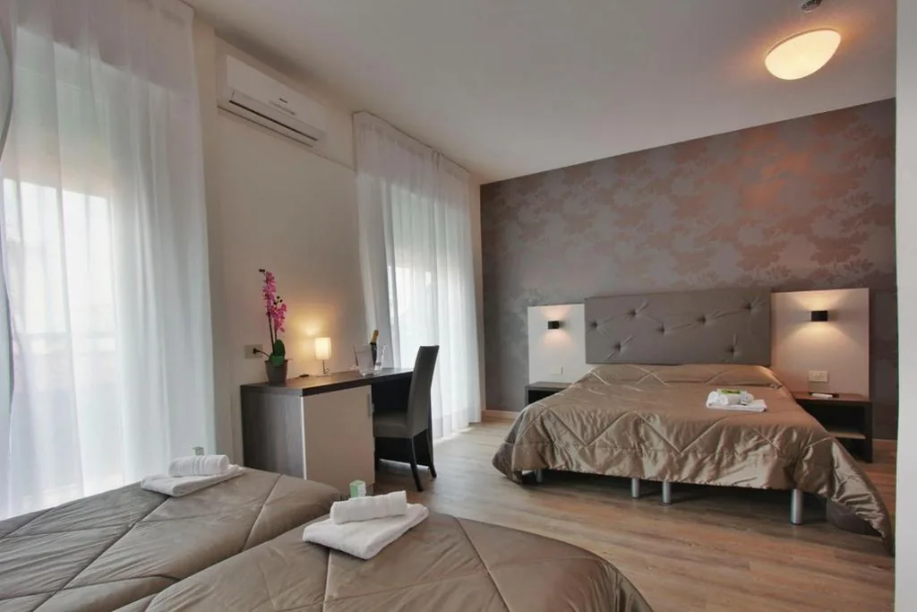 Quadruple Room — Hotel Gambrinus