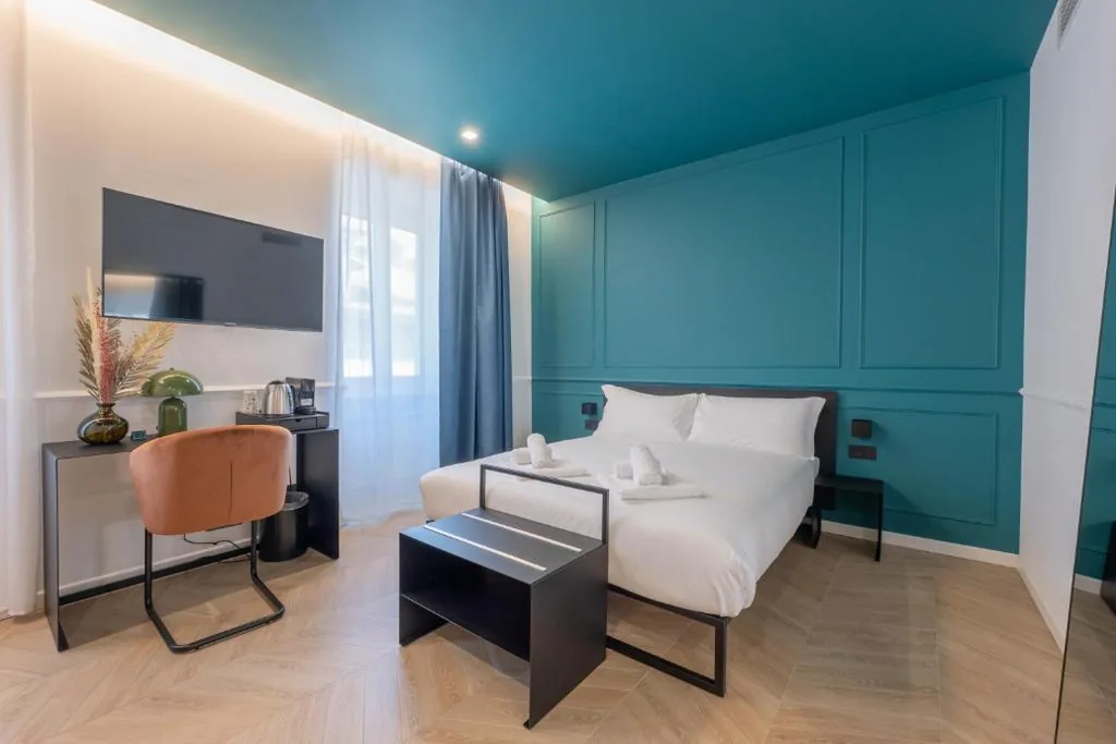 Camera Quadrupla Superior — Maria Cristina Boutique Rooms