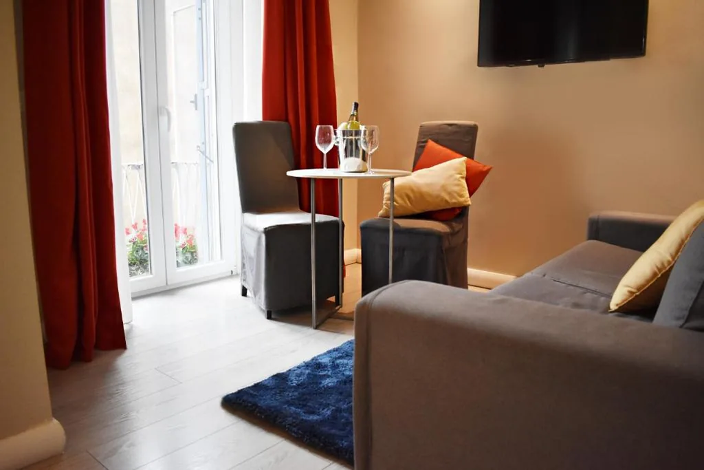 Junior Suite with Balcony — The Roman Empire Guesthouse