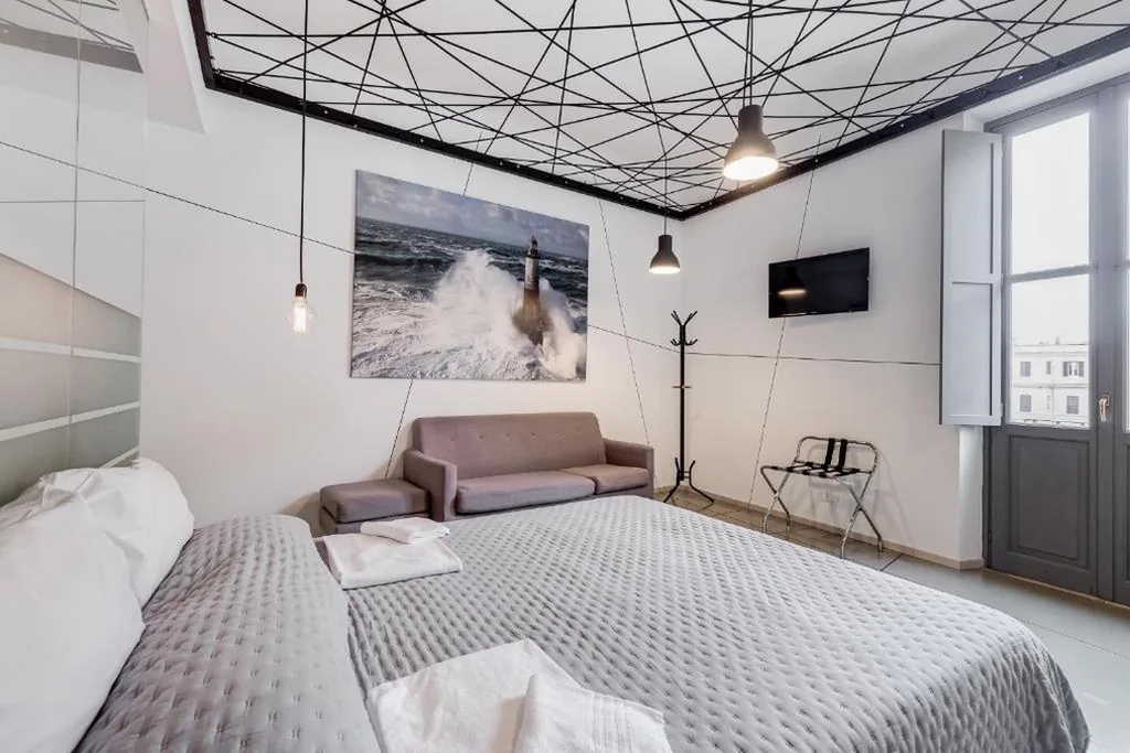Junior Suite con Balcone — The Upper Suites