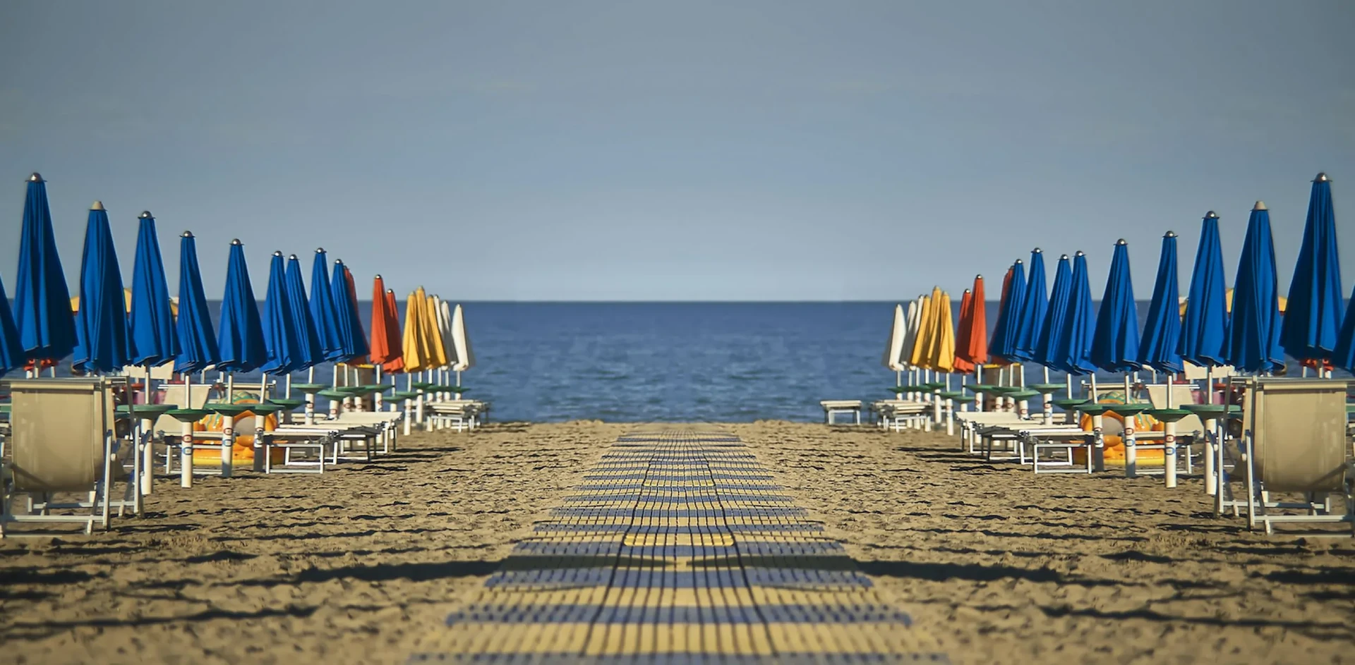 The golden sandy beach of Lignano Sabbiadoro facing the Adriatic