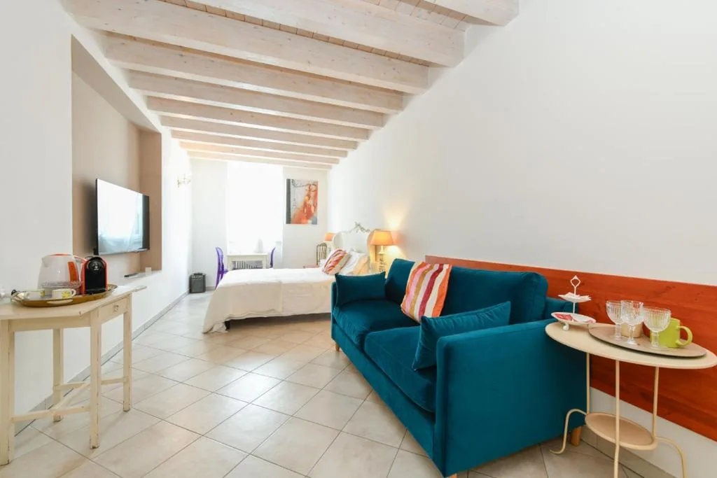 Camera Quadrupla con Vista Lago — Le Rêve – Lake view rooms