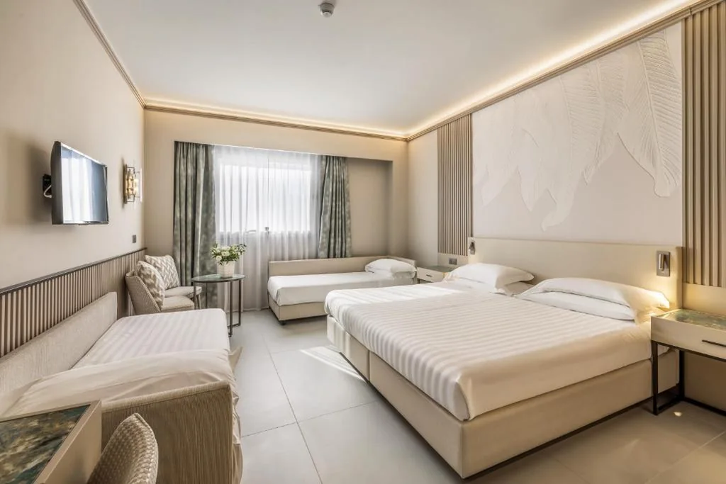 Deluxe Quadruple Room — Abacus Hotel