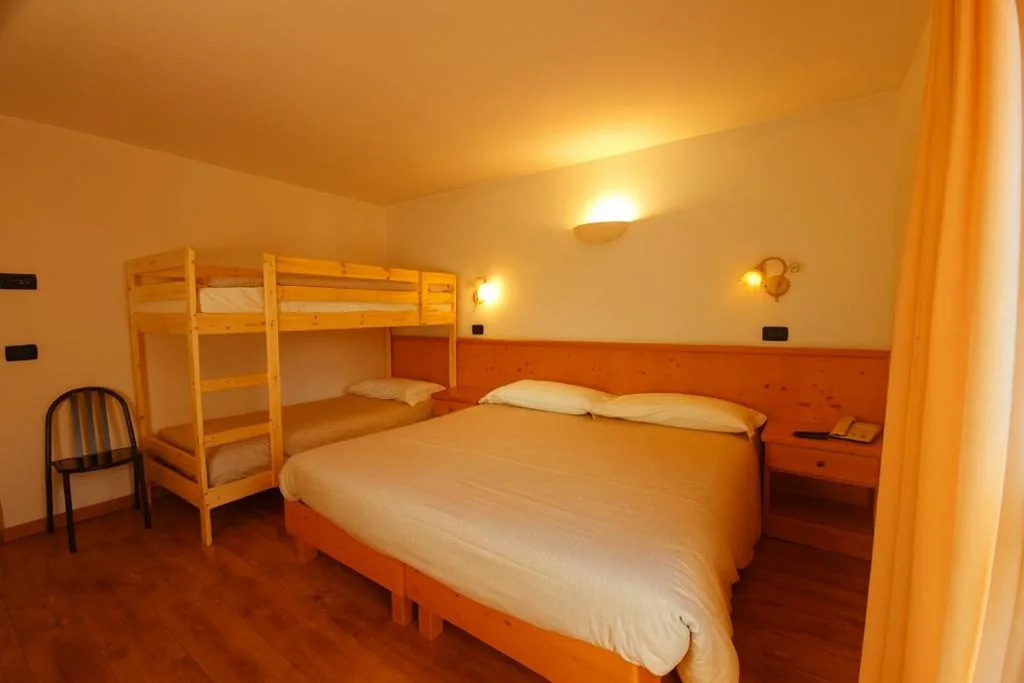 Deluxe Quadruple Room — Hotel Bleis