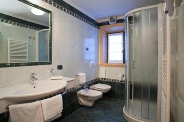 Quadruple Room — Hotel Capriolo