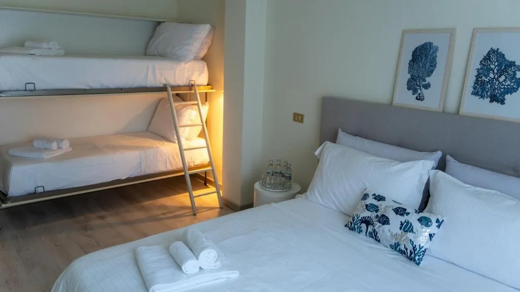 Quadruple Room — Hotel Eden