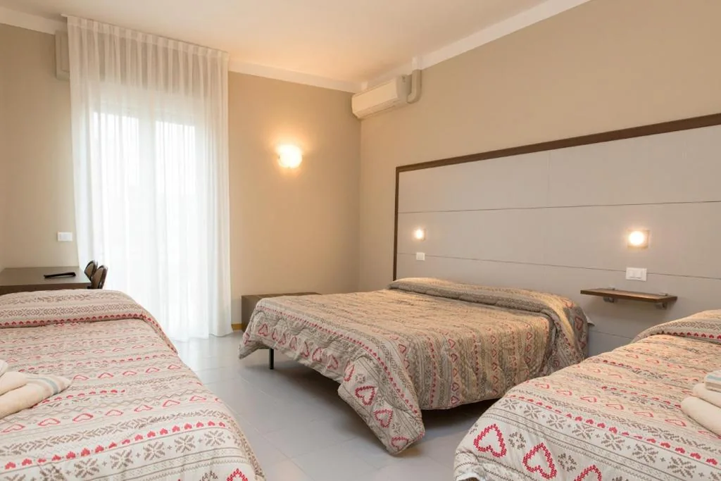 Quadruple Room — Hotel Olimpia