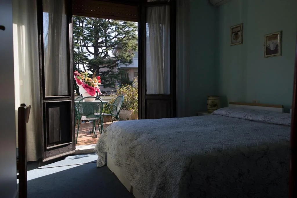 Quadruple Room — Hotel Primavera