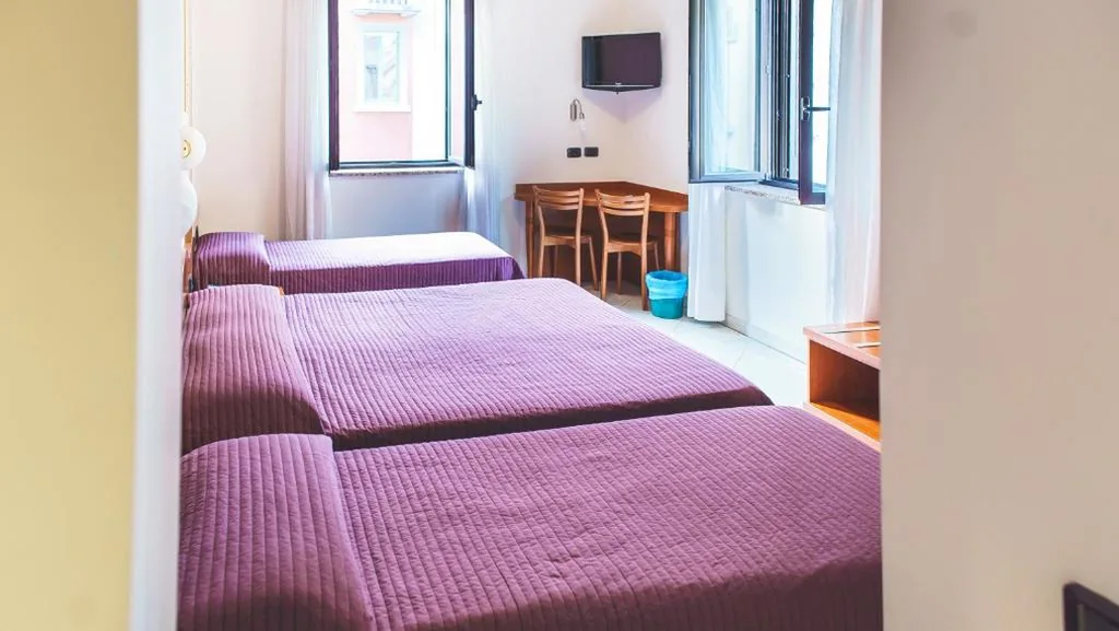 Quadruple Room — Hotel Venini