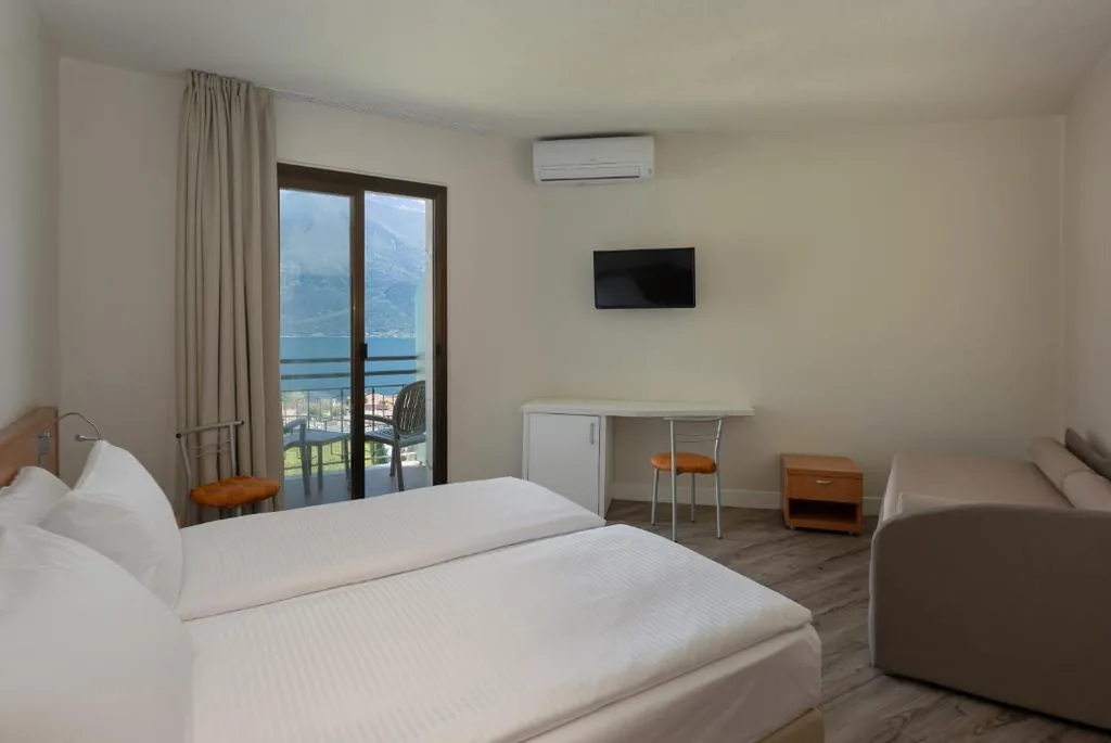 Standard Quadruple Room with Lake View — Hotel Royal Village