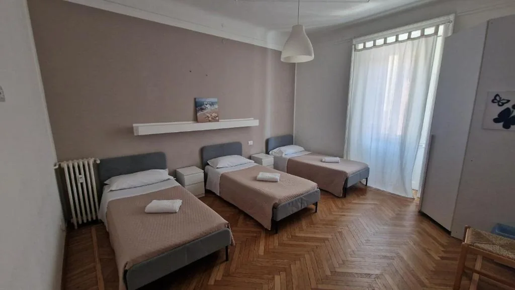 Basic Triple Room with Shared Bathroom — Lilly Home