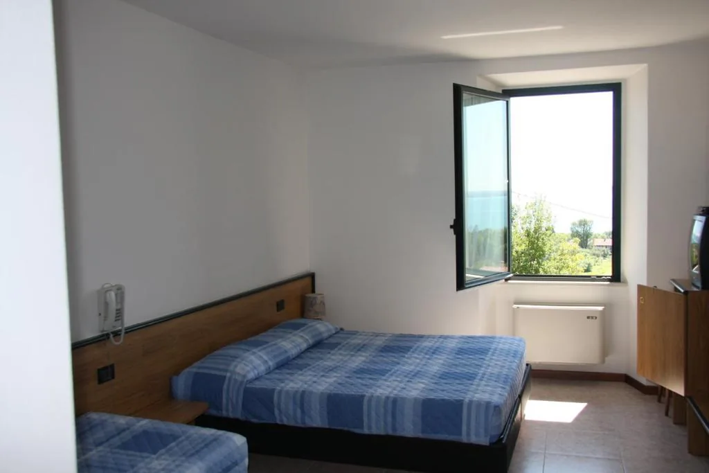 Triple Room Basic — Hotel La Pergola