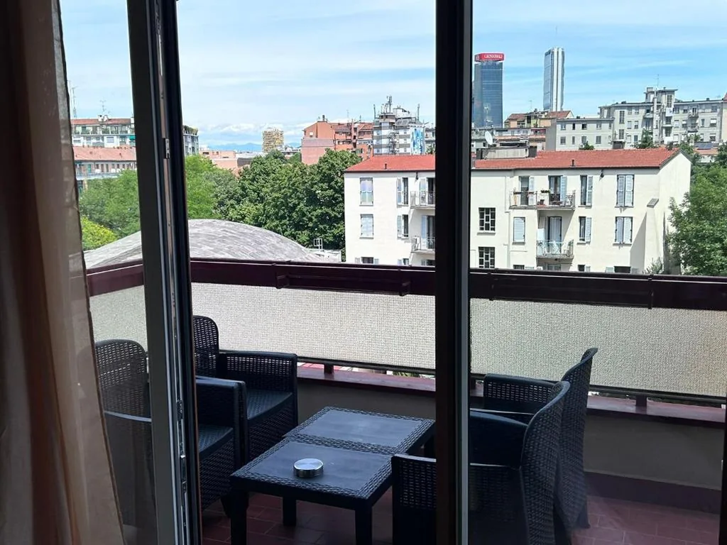 Triple Room with Balcony — Urban Suite Milano
