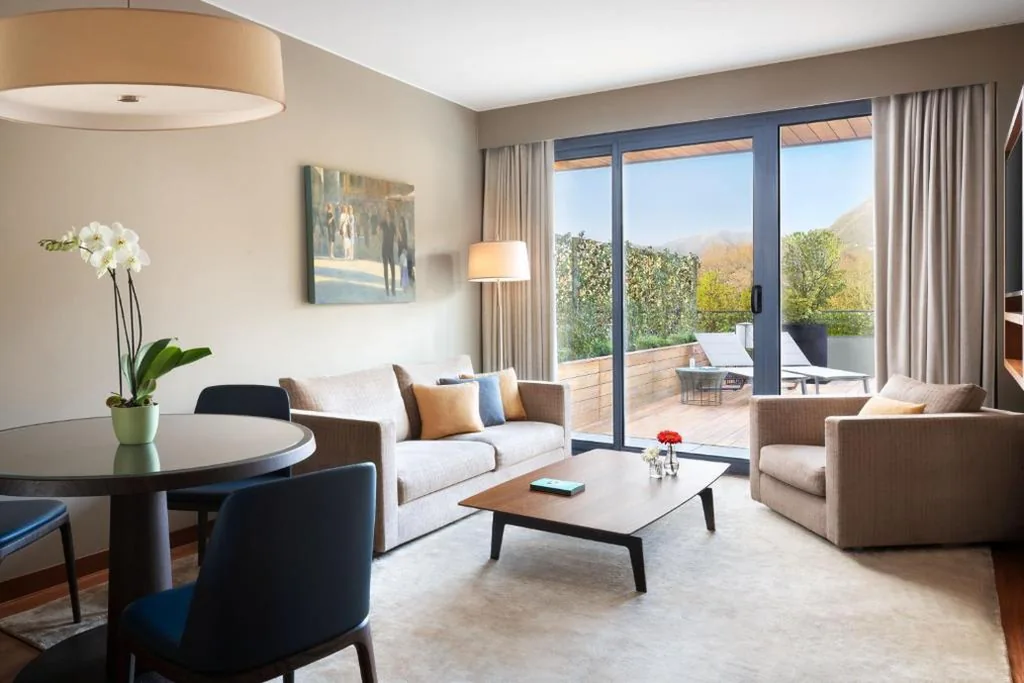 One-Bedroom King Suite with Sofa Bed, Balcony and Pool View — Sheraton Lake Como Hotel