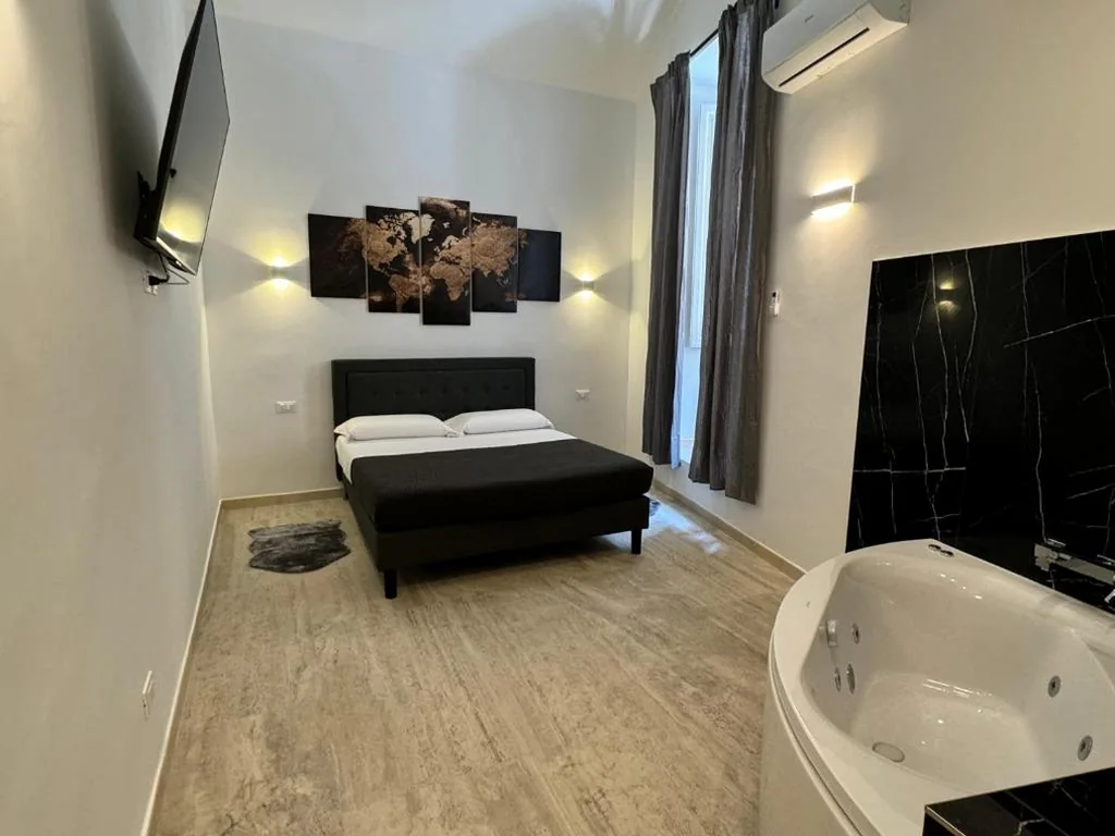 Suite with Jacuzzi Bathtub — Art Atelier Risorgimento Guest House