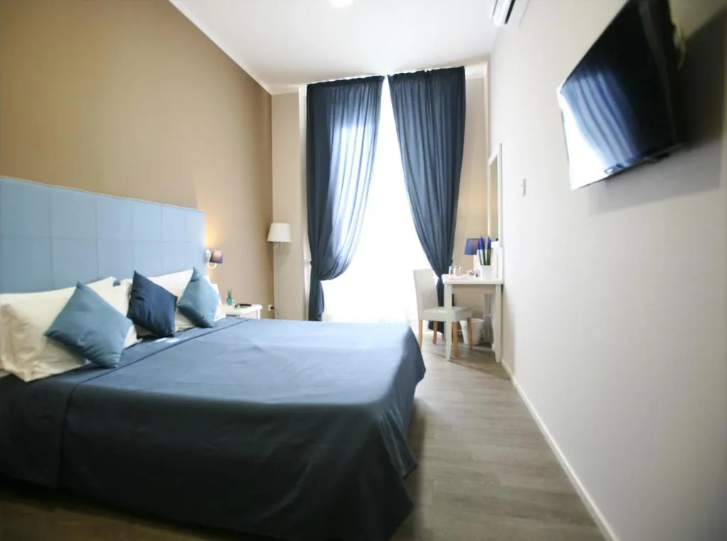 Camera Economy Matrimoniale/Doppia con Letti Singoli — Hotel Magenta