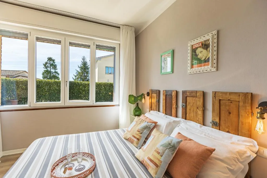 Camera Familiare con Angolo Cottura e Vista Giardino — B&B La Cornice