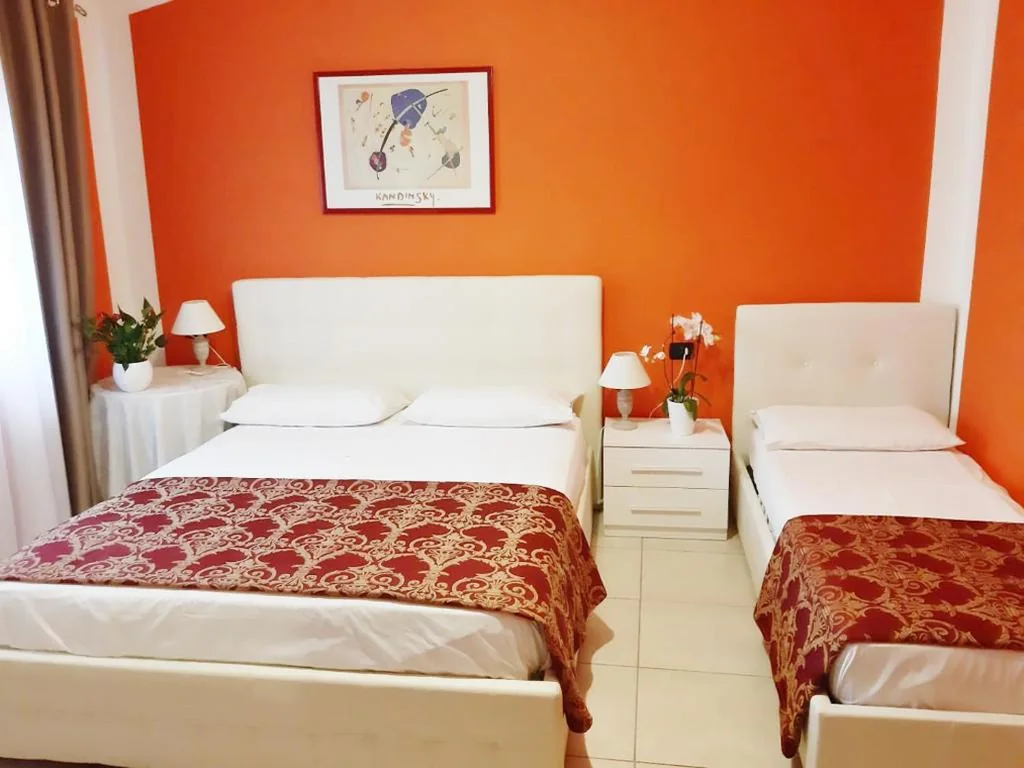 Camera Matrimoniale Deluxe (2 Adulti + 1 Bambino) — Da Laura