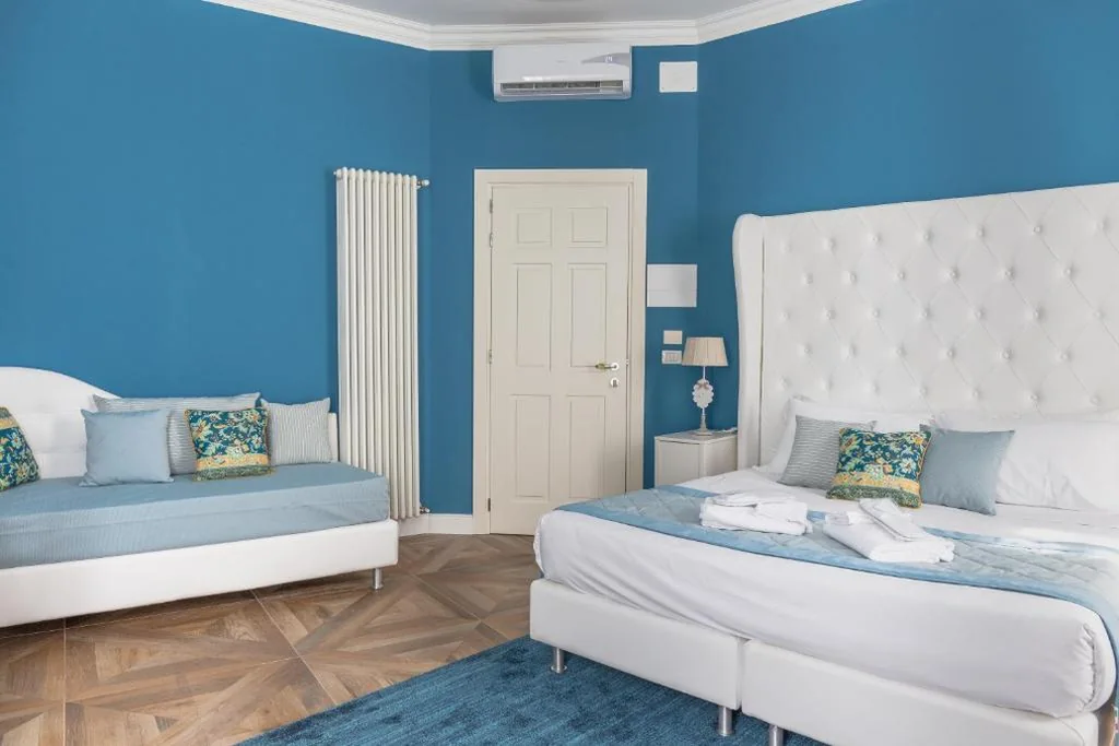 Camera Matrimoniale Deluxe con 1 Letto Supplementare — La Residenza di Michelangelo